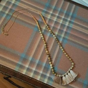 Long tassel necklace with wooden beads.